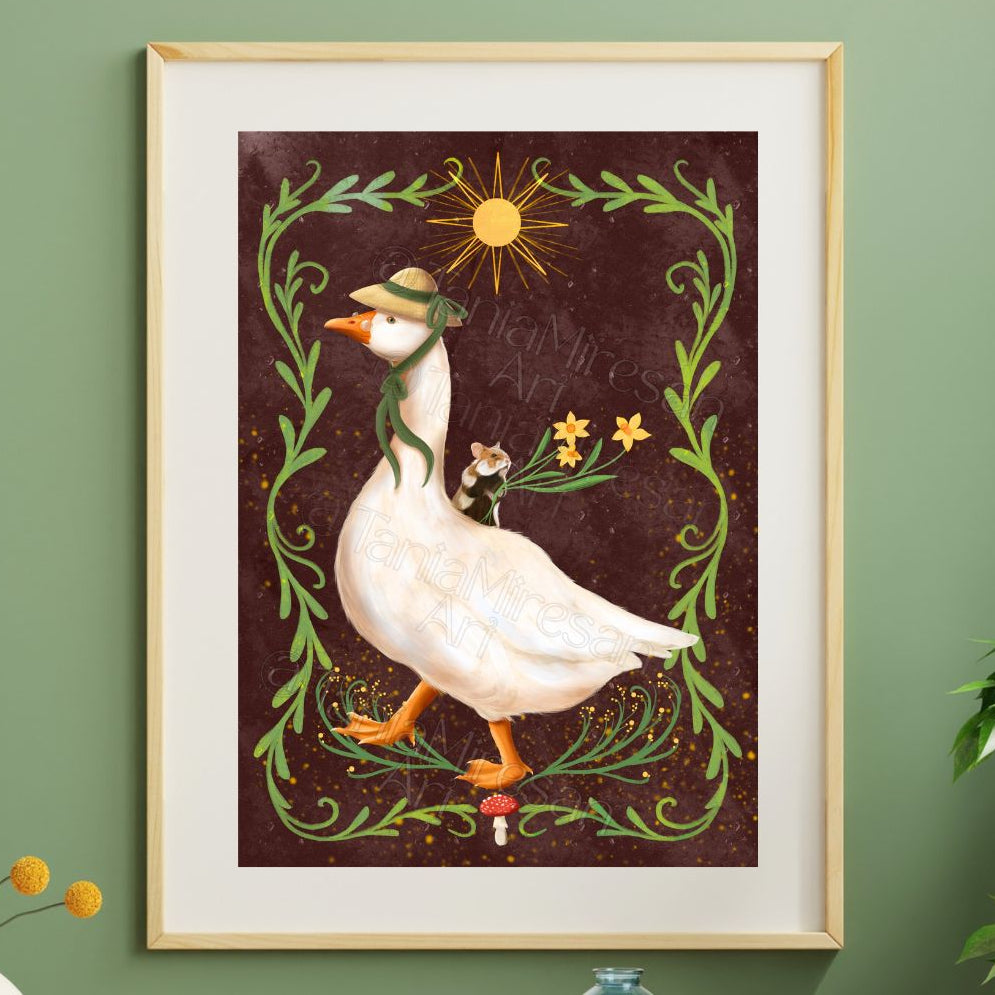 Framed wall art featuring a whimsical white goose wearing a green hat and scarf, walking under a yellow sun and surrounded by green vines and small flowers on a dark brown background, displayed on a green wall.