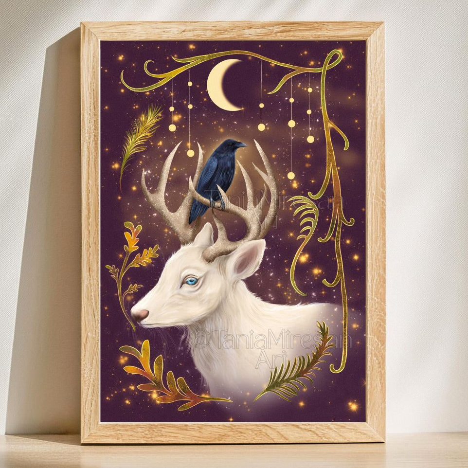 A framed art print featuring a white deer with antlers, a dark blue bird perched on its horns, a crescent moon, and gold decorative flourishes on a deep purple background, displayed against a light wall.